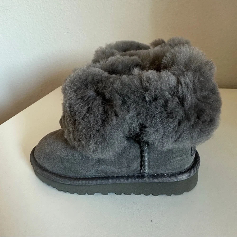 UGG Bailey Button II boots in grey suede with a single wood-button closure.